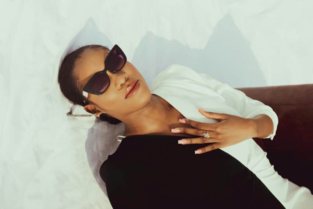 Woman wearing glasses laying down